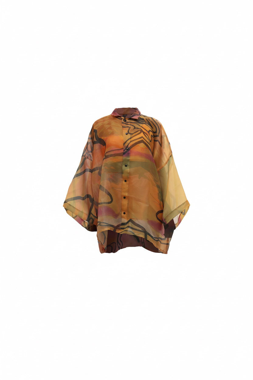 Colorful blouse with abstract patterns on a white background